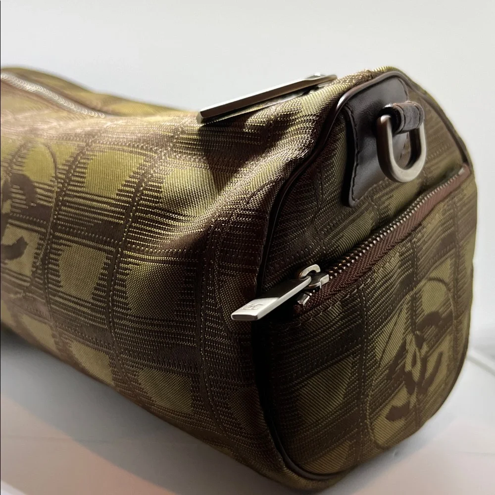 Chanel New Travel Line Mini Roll or Barrel Bag in a khaki or olive green color